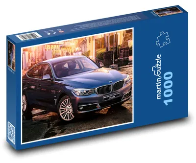 Obrázok produktu pre Puzzle 1000 Modré športové auto v meste - martinpuzzle