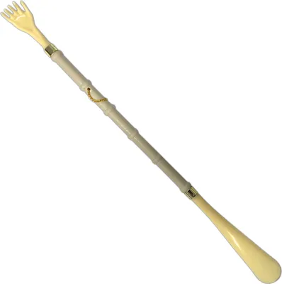 A product shot of a back scratcher and shoehorn combo tool.