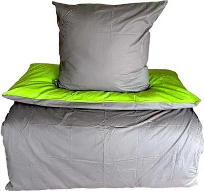 A neatly folded set of bedding, including a pillow and a duvet cover, against a white background.