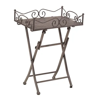 A metal folding side table with a decorative top and scrollwork.
