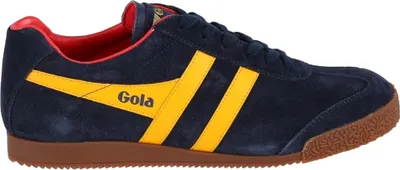 A side view of a blue Gola sneaker with yellow stripes and a red interior.