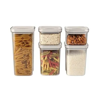 A set of clear plastic food storage containers filled with pasta, oats, almonds, and rice.