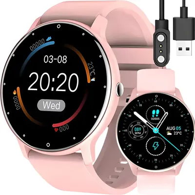 Two pink smartwatches are shown, one larger and in focus, with a charging cable in the background.