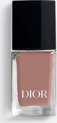 A close-up studio shot of a Dior nail polish bottle.