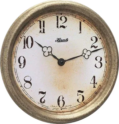 A close-up studio shot of a round wall clock with a vintage-inspired design.