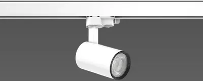 A white track light fixture is mounted on a white track against a gray background.