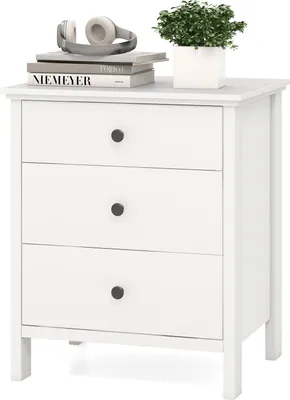 A white three-drawer nightstand with books and headphones on top.