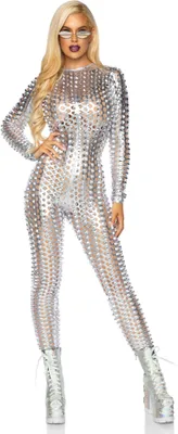 A woman wearing a metallic catsuit and boots, posing against a white background.