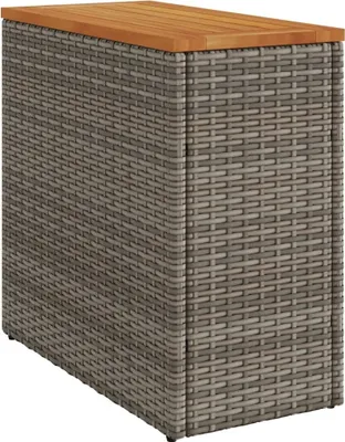A product shot of a rattan side table with a wooden top on a white background.