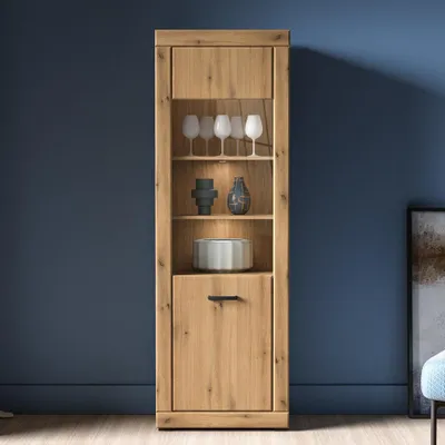 A wooden display cabinet with glass shelves and a drawer, set against a blue wall.