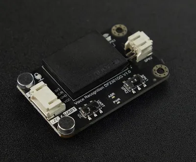 A close-up shot of a voice recognition module on a black surface.