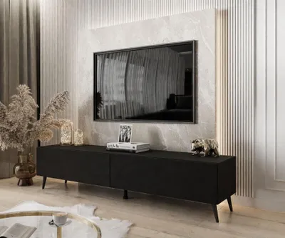 A modern living room with a TV stand and television.