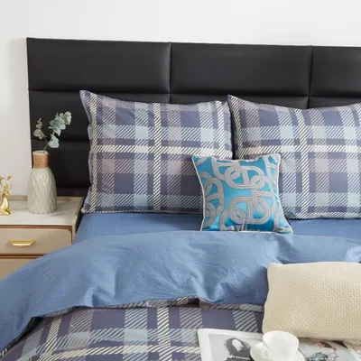 A bed with pillows and a headboard.