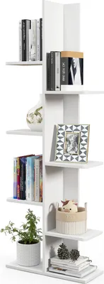 A white, multi-tiered bookshelf with various items placed on its shelves.