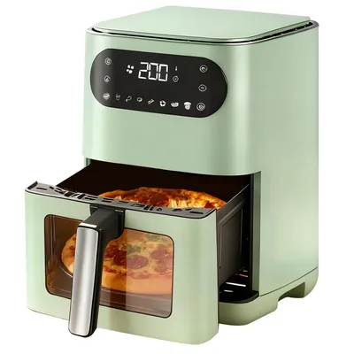 A green air fryer with a pizza inside, shown with its drawer pulled out.