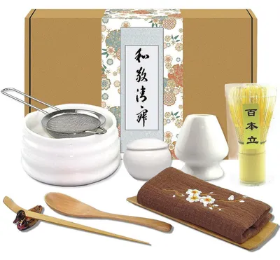 Immagine prodotto di Set giapponese da tè Matcha, composto da 10 pezzi: tazza, frusta in bambù, supporto, spatola, cucchiaino, panno, contenitore per la polvere e setaccio (colore bianco/legno)