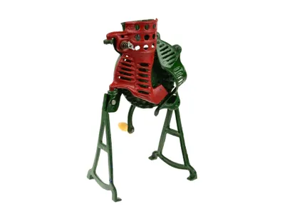 A vintage-style corn sheller machine on a white background.