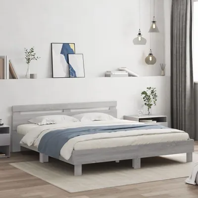 A bed frame with a headboard is displayed in a bedroom setting.