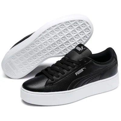 A pair of black Puma Vikky Stacked L sneakers with white soles, shown from a slightly elevated side angle.