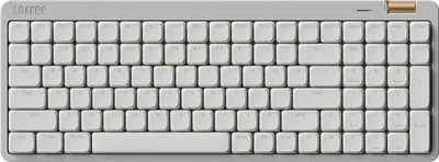 A top-down view of a light gray mechanical keyboard with gold accents.