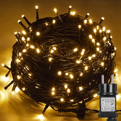 A coiled string of warm white LED lights with a power adapter.
