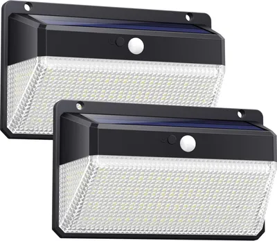 Two solar-powered outdoor lights with motion sensors are shown against a white background.