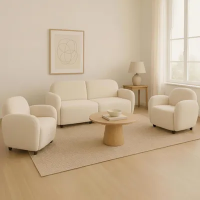 A living room scene with a sofa and two armchairs.