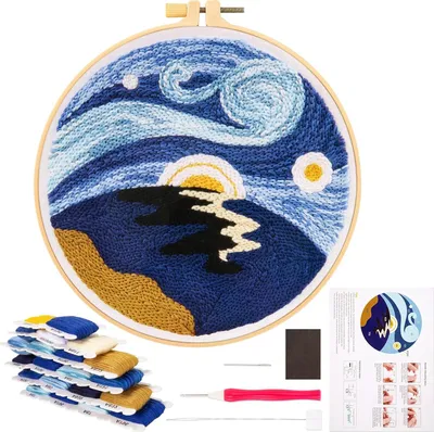 A punch needle embroidery kit with a finished "Starry Night"-inspired design, threads, and tools.
