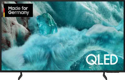 A Samsung QLED TV displaying a vibrant, abstract image with ice-like formations.