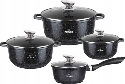 A set of four black granite-coated pots and pans with glass lids and silver handles, arranged on a white background.