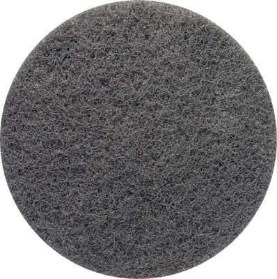 A close-up, top-down view of a circular gray abrasive pad.