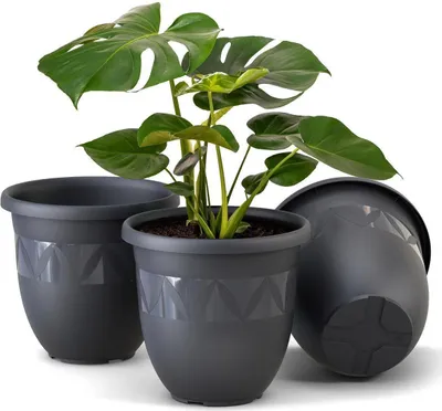 Three dark gray planters are shown against a white background. One planter in the center contains a green plant.