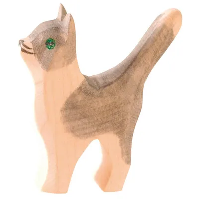 A wooden toy cat figurine.