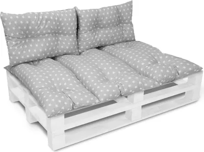 A pallet sofa with cushions on a white background.