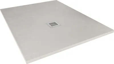 A grey shower tray with a drain cover in the center, shown from a diagonal angle.