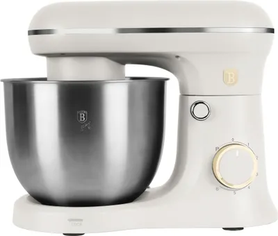 A studio shot of a cream-colored stand mixer with a silver bowl.
