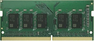 A close-up, top-down view of a green circuit board with black memory chips.
