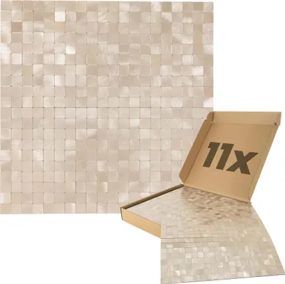 A product shot of self-adhesive mosaic wall panels in a box, with a larger display of the panels in the background.