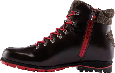 A side view of a brown leather boot with red laces and red zipper.