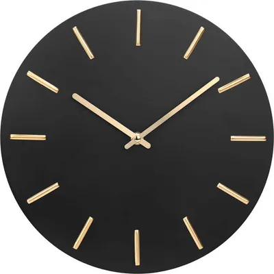 A black wall clock with gold hour markers and hands.