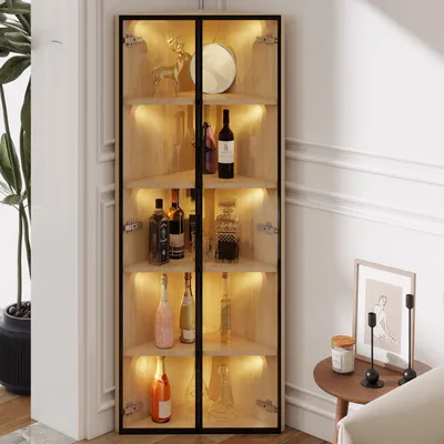 A corner display cabinet filled with bottles and decorative items, illuminated by internal LED lights.