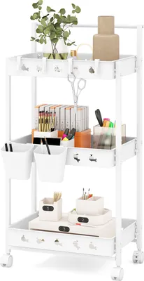 A white three-tiered rolling cart filled with art and craft supplies.