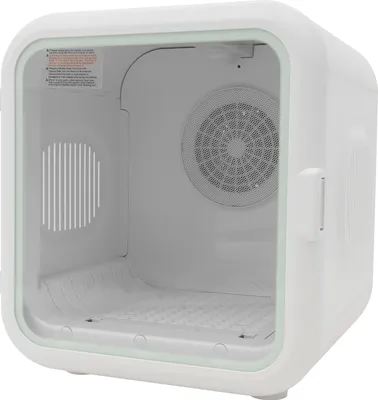 An empty white pet dryer with a clear front door, showing the interior with a fan and a textured floor.
