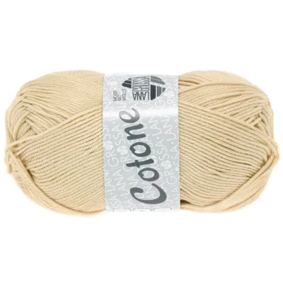 A ball of beige yarn with a label wrapped around it.