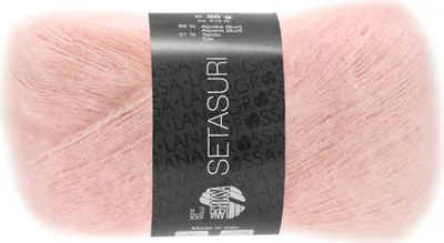 A ball of pink yarn with a label.
