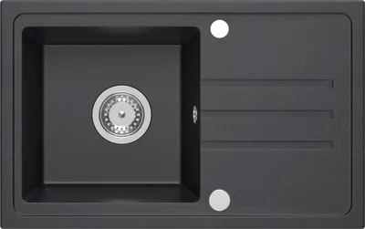 A top-down view of a black granite kitchen sink with a silver drain and faucet holes.