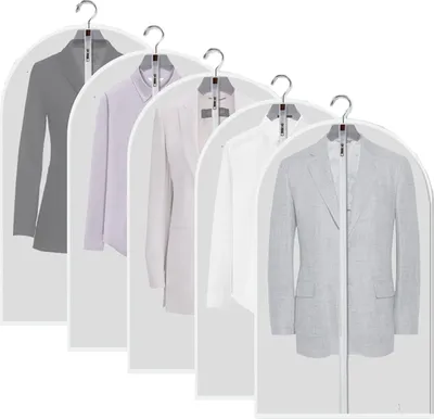 Multiple suits and jackets hanging in protective garment bags.