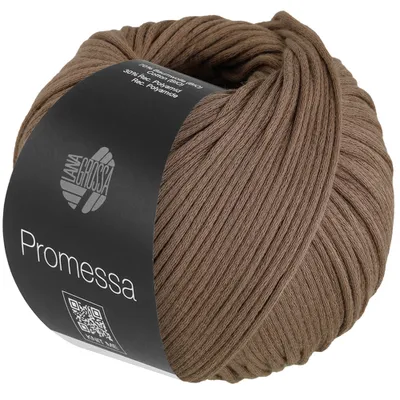 A ball of brown yarn with a black label wrapped around it.