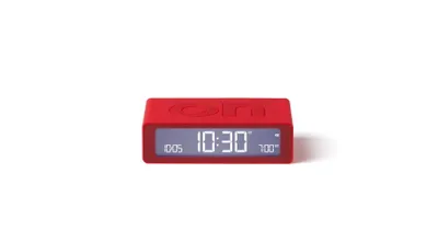 A red digital alarm clock is shown on a white background.