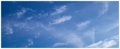 Produktbild von Wallario Wandbild aus Acryl, 125 x 50 cm, freischwebende Optik - Blauer Himmel mit vereinzelten Wolken